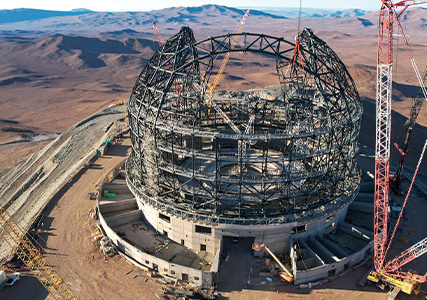 Afiche del evento "Construyendo el telescopio más grande del mundo"